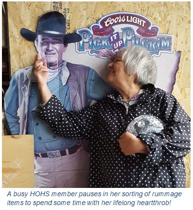 women with life-sized John Wayne cutout